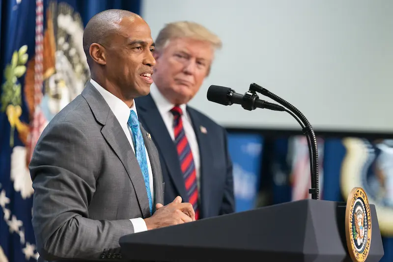 Archive. President Donald J. Trump listens as Scott Turner, executive director of the White House Opportinuity and Revitalization Council, addresses the audience Wednesday, April 17, 2019, at the Opportunity Zone Conference with state, local, tribal and community leaders in the South Court Auditorium of the Eisenhower Executive Office Building at the White House. (Official White House Photo by Shealah Craighead)